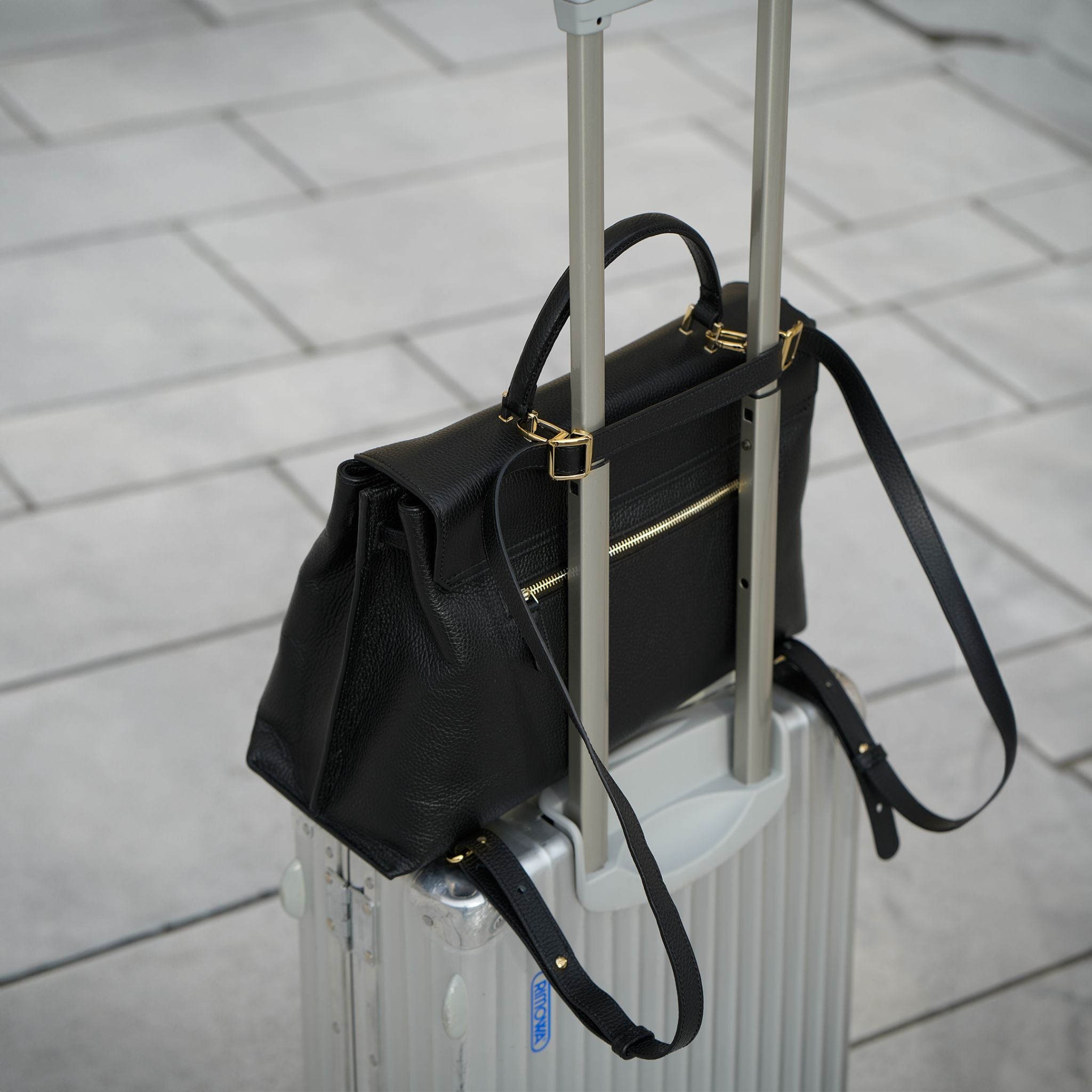 AMELI Zurich | VIADUKT WORK 24 | Black | Soft Grain Leather | Attached to th suitcase